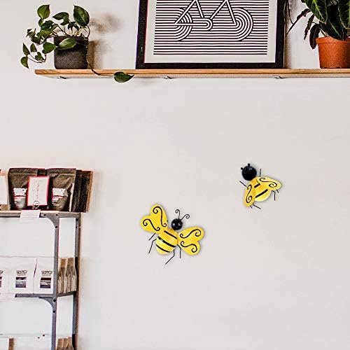 Metallic wall art set featuring bees in a backyard setting.