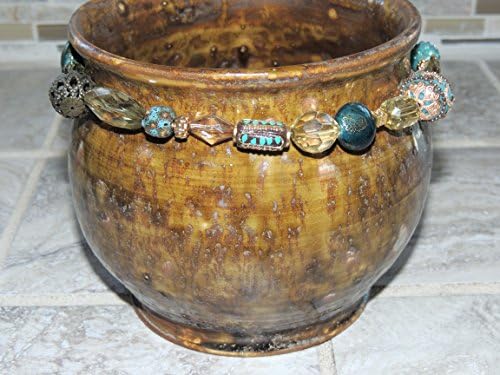 Hand thrown ceramic bowl/vase. Rustic brown and green glaze. Hand beaded around the top.. Food and dishwasher safe. One of a kind. 5 x 6.6 wide,