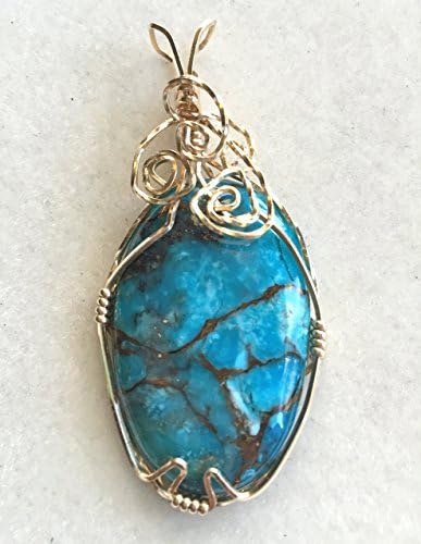A Wire Wrapped Mojave Turquoise Cabochon Pendant
