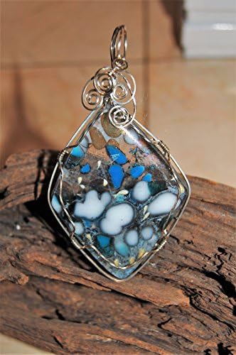 "Guardian Spirit" A Sterling Sliver Wire Wrapped Galaxy Glass Pendant. This is a Handmade Galaxy Glass Pendant - Shades of Blue and Grey Seem to be Suspended in Air, silver "spirits" dance on the top.