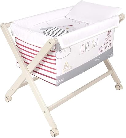 white crib with wood legs