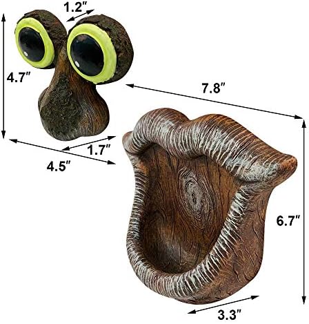 Tree face sculpture with eyes, mouth, and bird feeder feature.