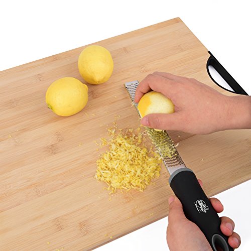Stainless Steel Citrus Zester & Hand Safe Guard – Lemon, Orange & Lime Grater With Silicone Handle, Cover & A Finger Protector – Grate Cheese, Chocolate, Ginger, Garlic, Coconut, Onions & Potatoes