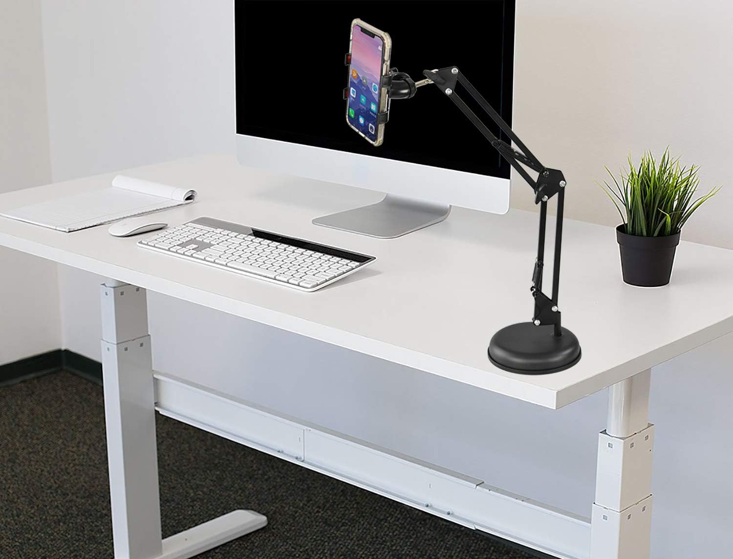 HOME-X Desktop Telescopic Phone Stand, Adjustable Height and Weighted Base, Universal Phone Clip and Flexible 360-Degree Rotation, Black, 6” D adjusts from 10” – 24” H