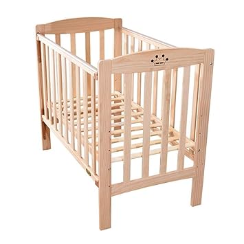 beige baby crib