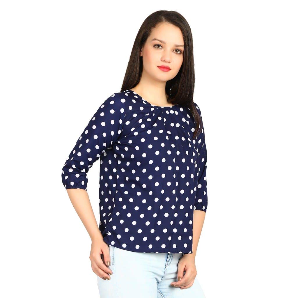 blue top with white polka dots