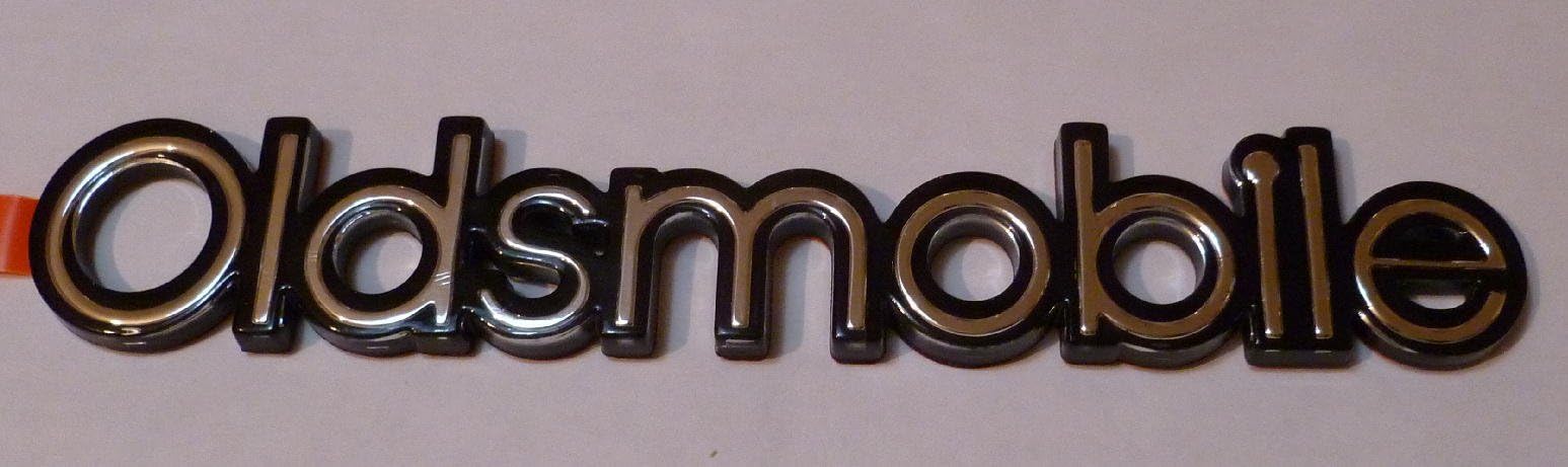 Oldsmobile Cutlass Emblem for Taillight Back Up Lamp Trunk 92 93 94 95 96 97 NEW OEM 7 3/8" x 1 1/4"