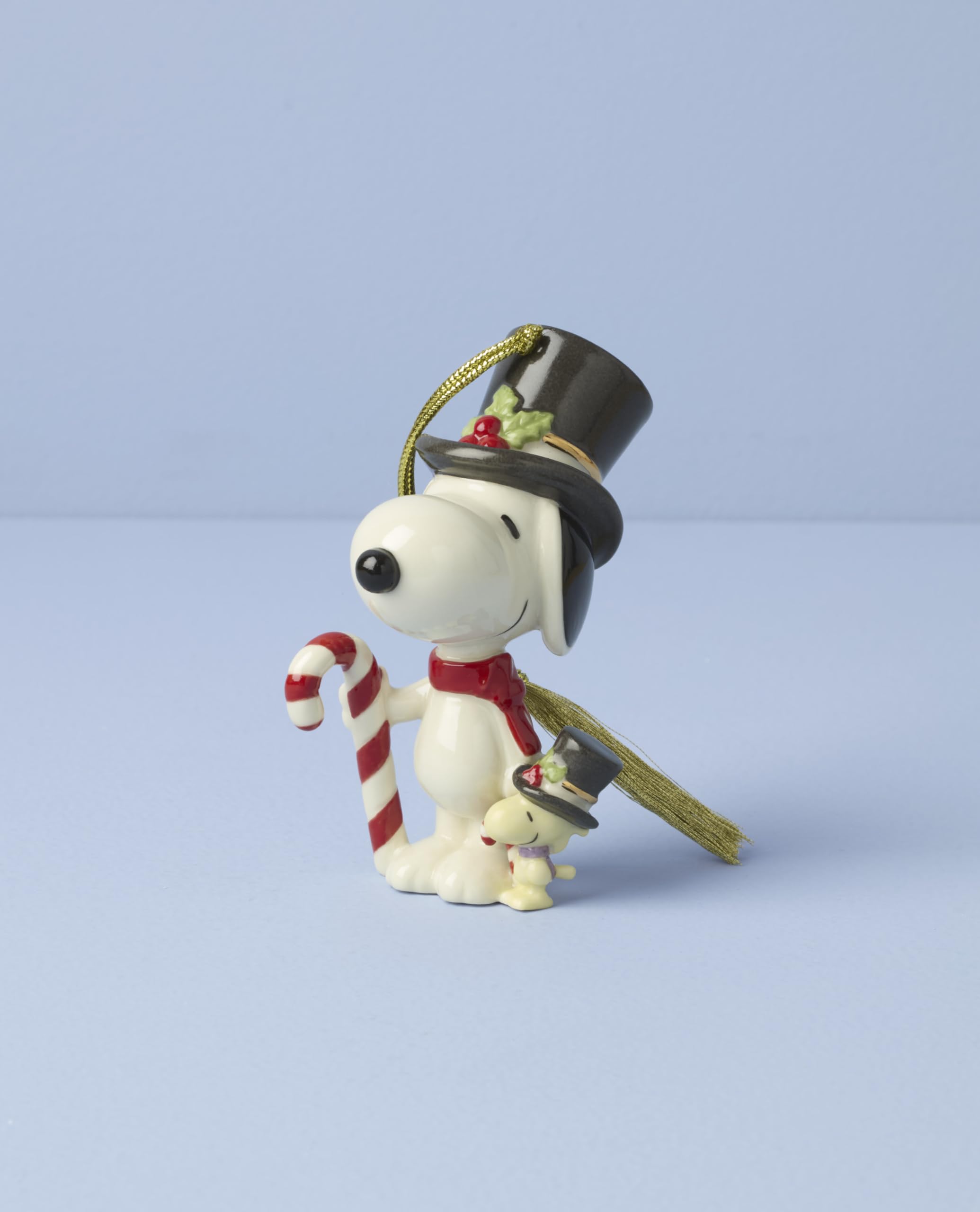 Condition photo showing New/Like New for lenox ornaments, snoopy & woodstock with candy cane ornament, porcelain material, gold cord for tree