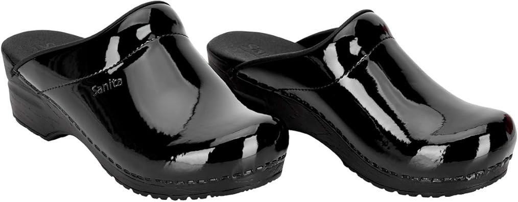 sanita black patent clogs