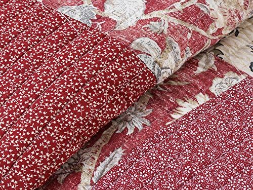 King-size quilt set with a design featuring a mix of geometric patterns in shades of blue, white, and gray.