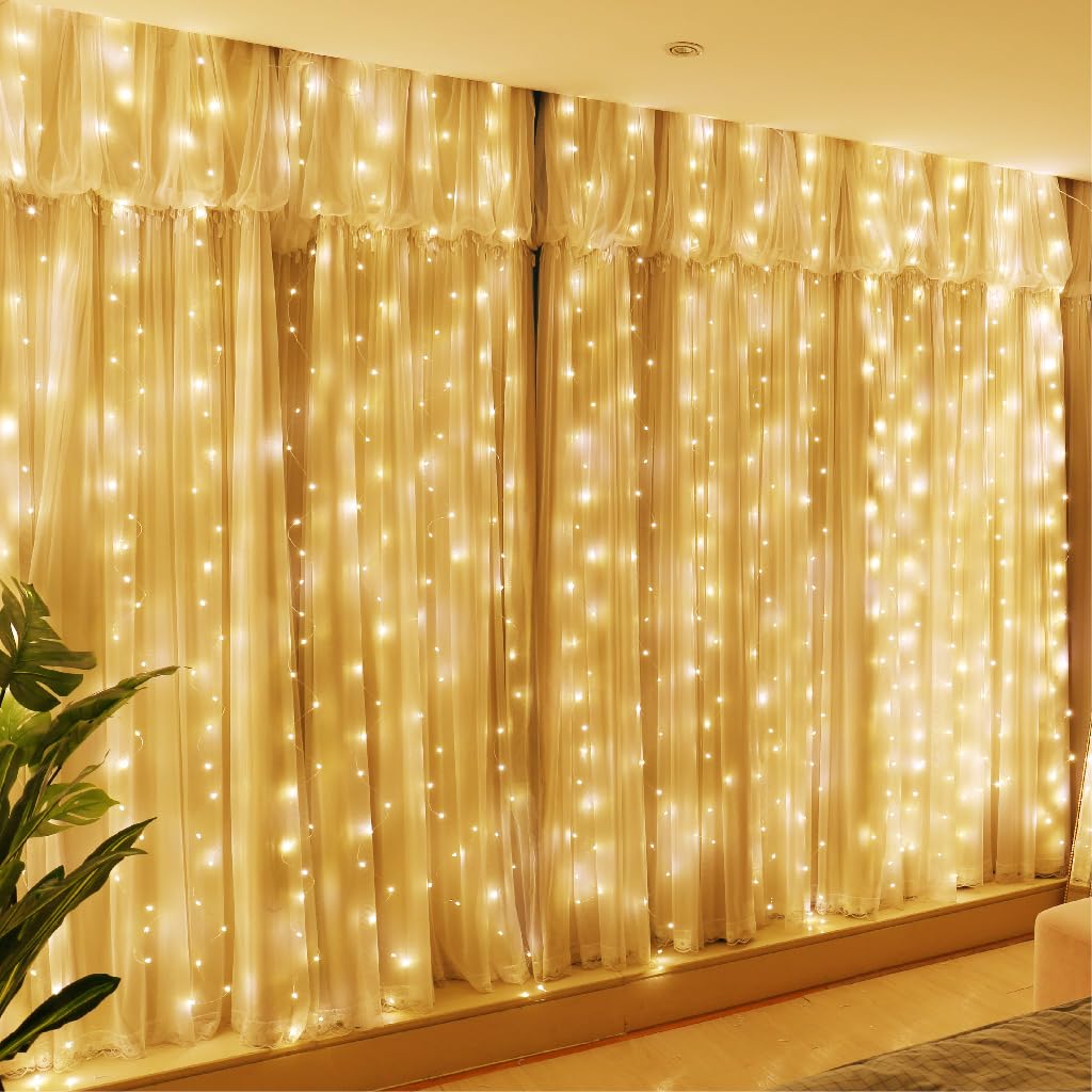 Photo 1 of HXWEIYE 300LED Fairy Curtain Lights, 9.8x9.8Ft USB Plug-in 8 Modes Christmas String Hanging Lights with Remote for Bedroom Backdrop Wedding Party Indoor Wall Decor, Warm White