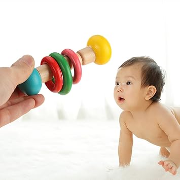 when do babies start holding rattles