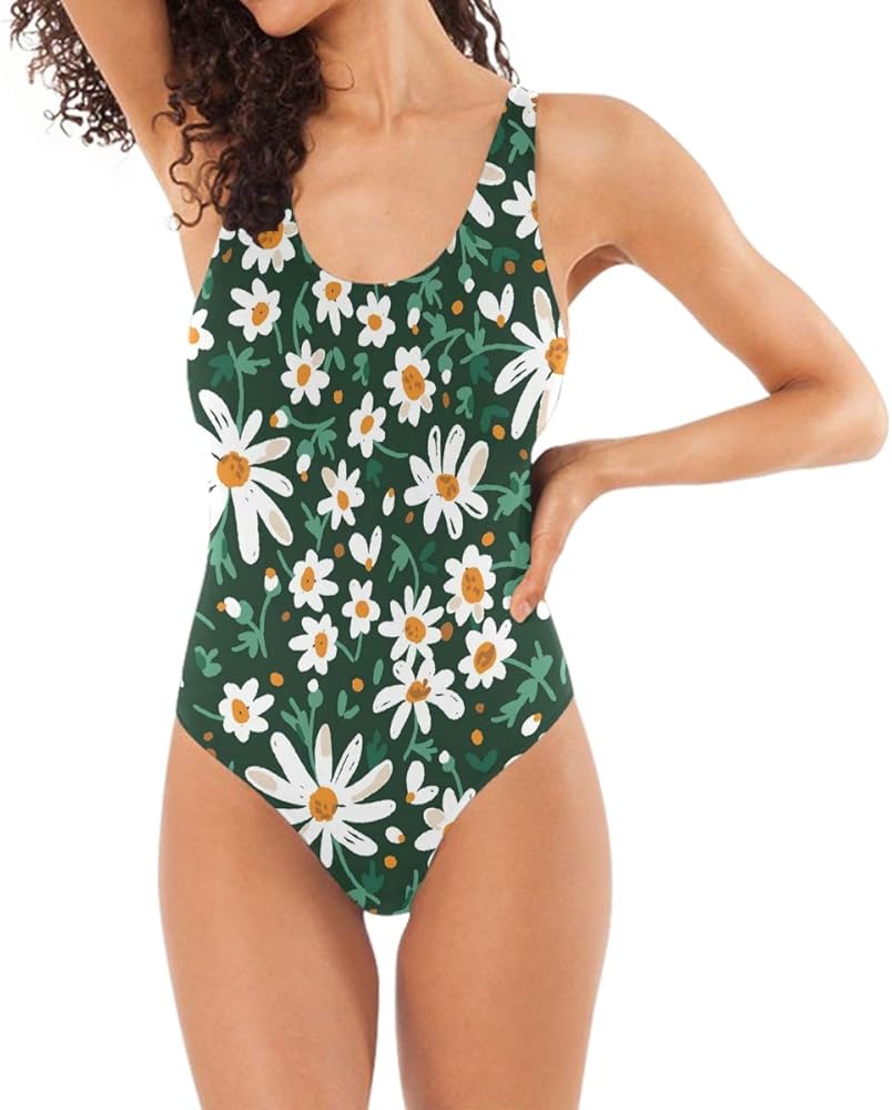 white swimsuit with green leaves