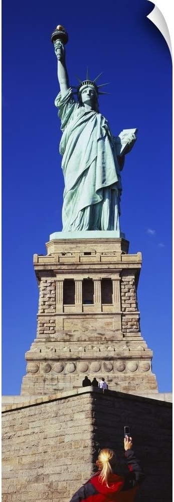 CANVAS ON DEMAND Low Angle View of a Tourist Taking a Picture of a Statue, Statue of Liberty, Liberty State Park.