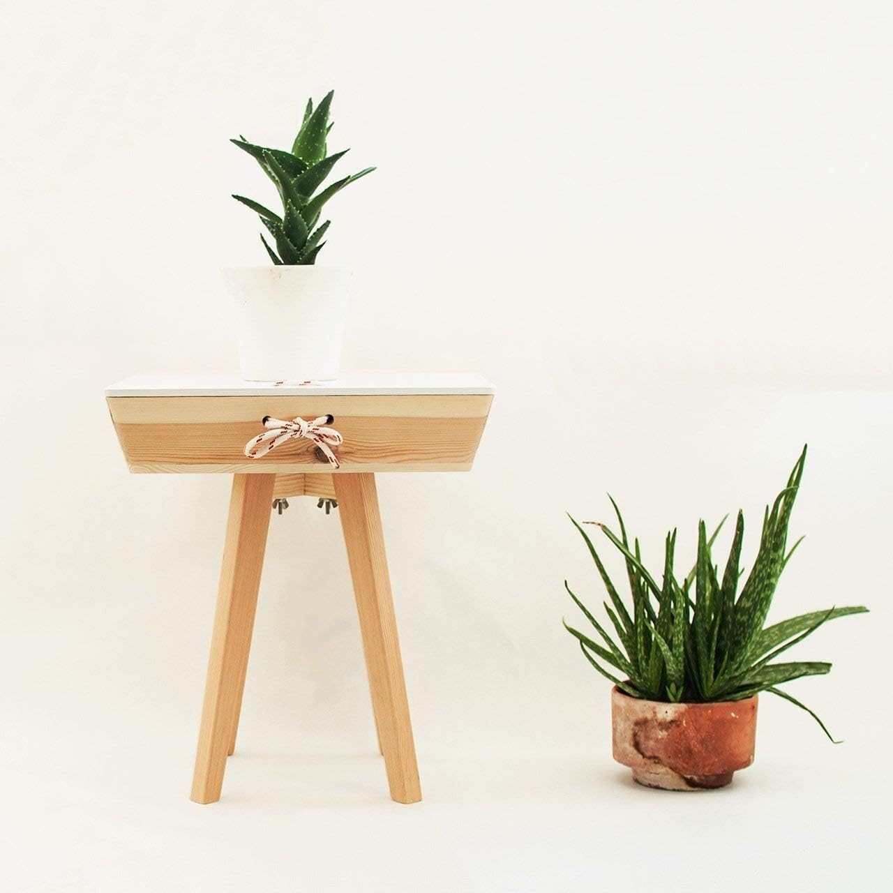 Modern Scandinavian wood bedside table with drawer. Foldable nightstand and coffee table
