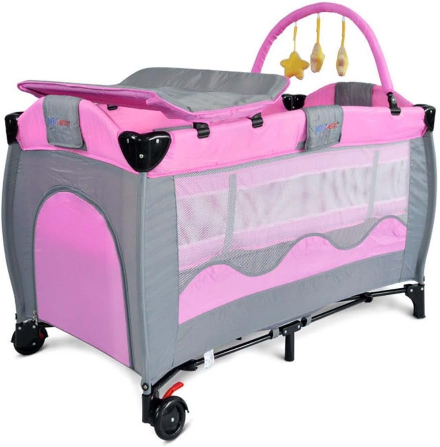 pink crib with changing table