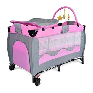 pink crib with changing table