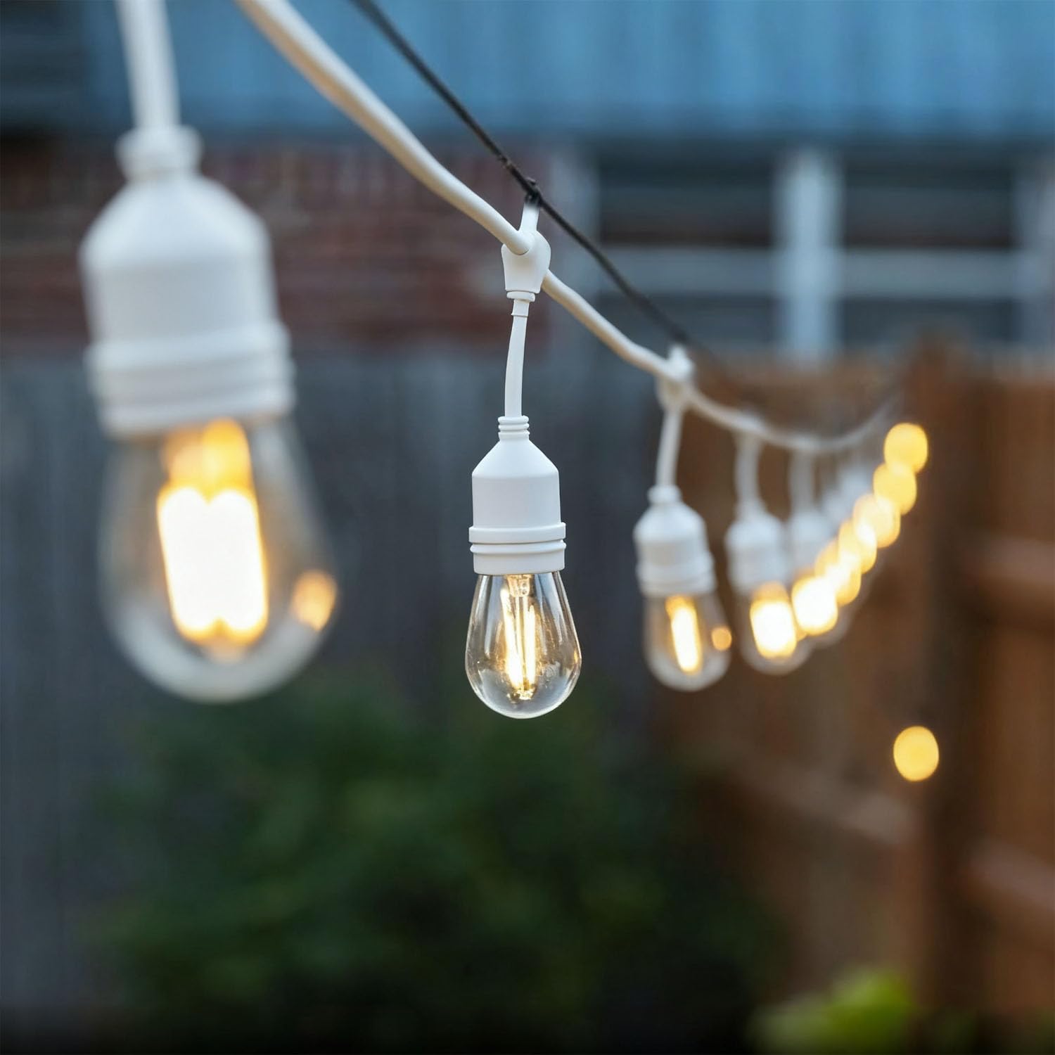 Photo 1 of NIOSTA Outdoor String Lights, LED 24FT White Cord 12 Hanging S14 Bulbs,2200K