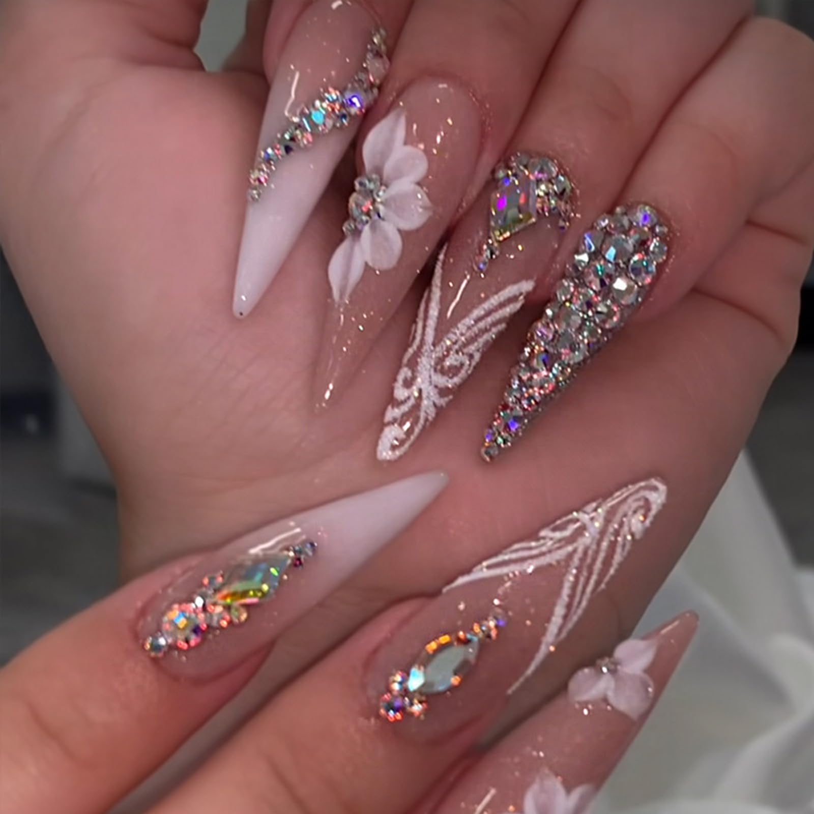 Photo 1 of UEYRSEDB Long Press on Nails Stiletto Fake Nails with Rhinestones Charms Designs White Ombre French Tip False Nails Spring Flower Glue on Nails Luxury Glitter Stick on Nails for Women Girls 24Pcs