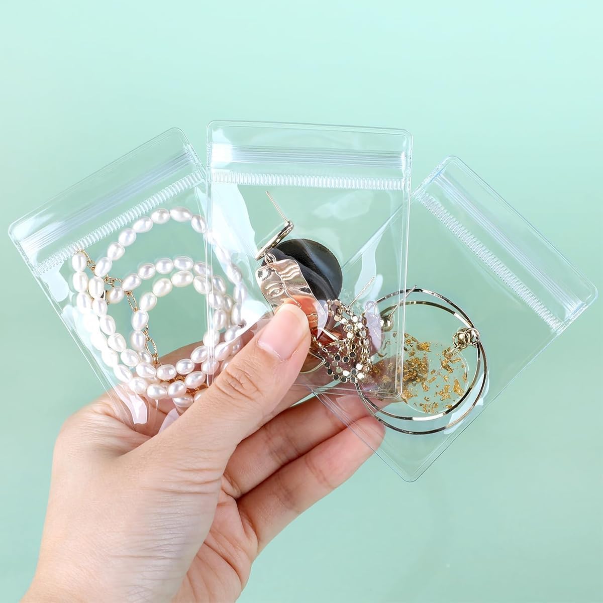 Photo 1 of 100 PCS Self Seal PVC Pack Sealed Bag Clear Jewelry Organizer Bag Resealable Anti Tarnish Jewelry Bags for Rings Earrings Necklace Jewelry (Transparent-M)