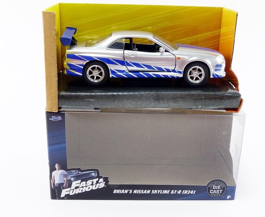 Amazon Com Jada Toys Fast Furious 1 32 Brian S Nissan Skyline Gt R R34 Die Cast Car Silver Blue Toys For Kids And Adults Toys Games
