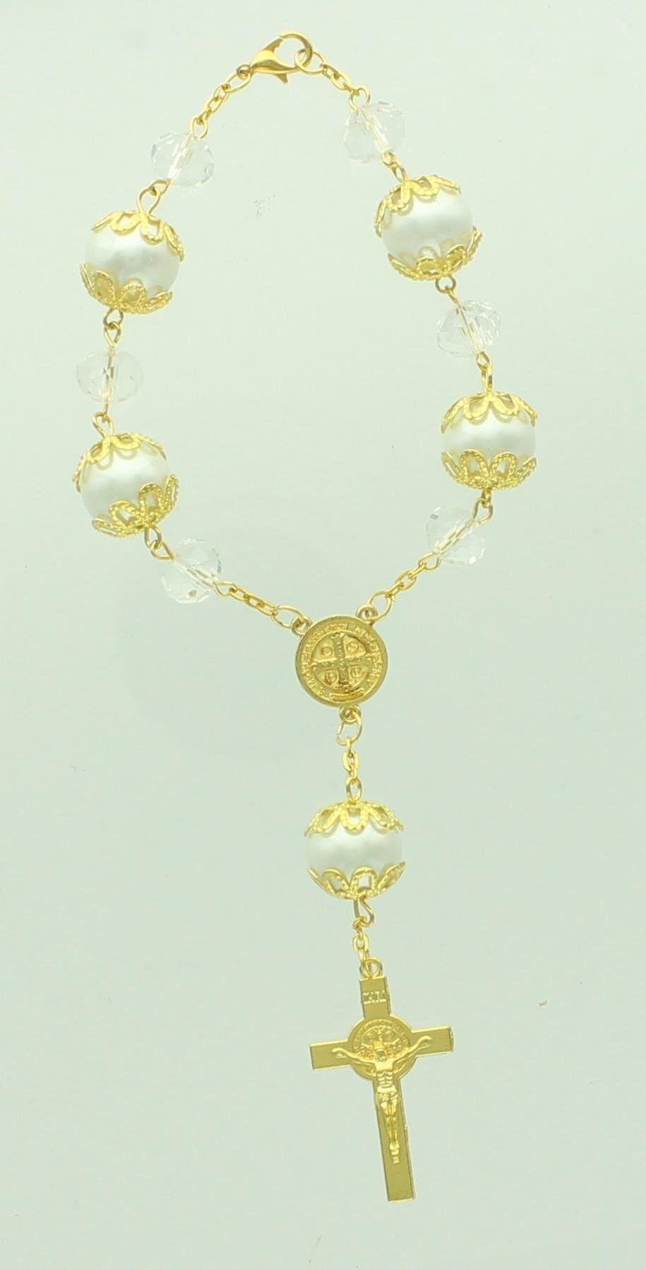 Gold Tone White Bead St. Benedict Center Piece & St. Benedict Cross Braclet. Total Length Is Approx 7 Inches, 14mm Crystal White Beads and 10mm Crystal Bead