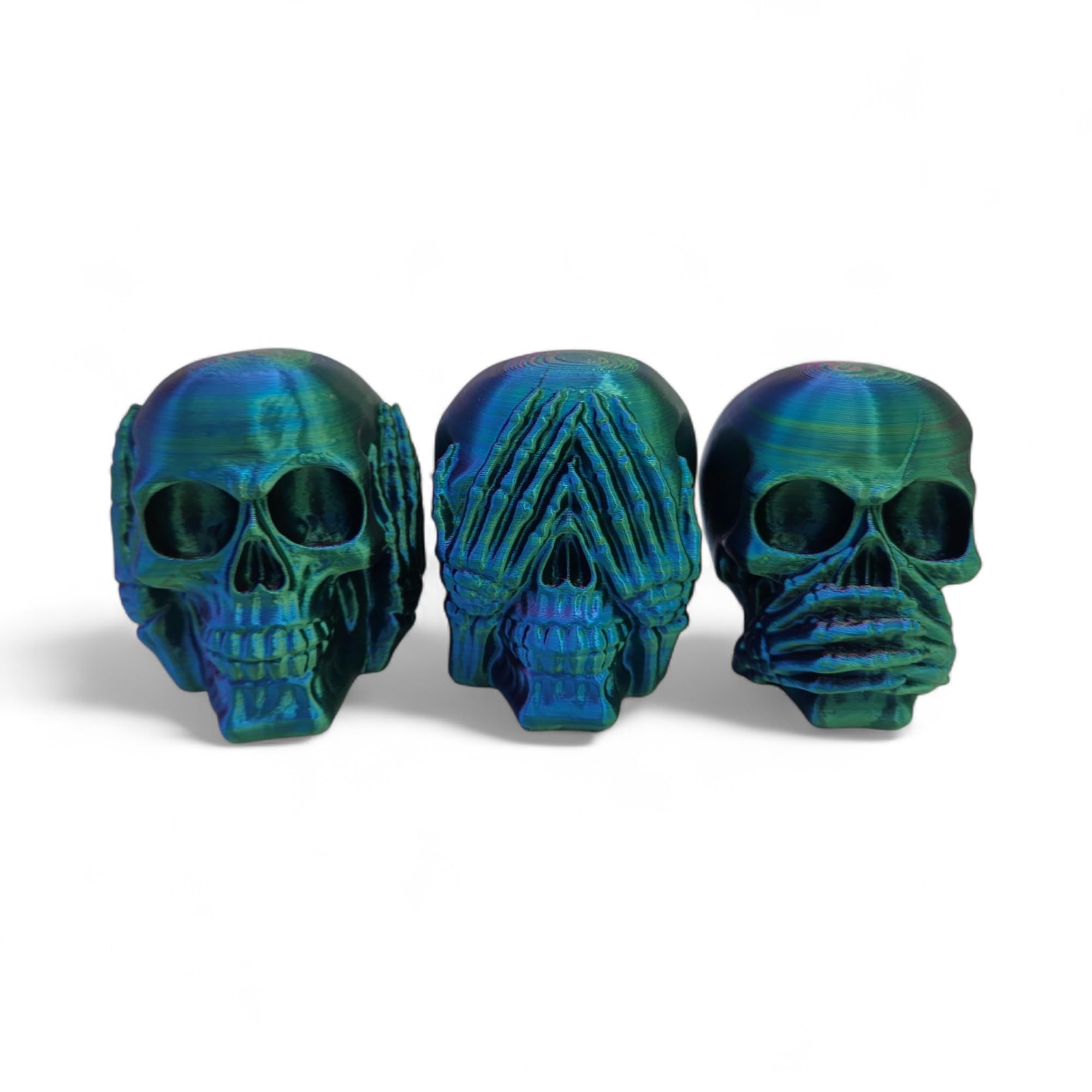 Photo 1 of ZZ LIFE Set of 3 Skull Figurines – Hear No Evil, Speak No Evil, See No Evil – 4x3x2.5 Inch Halloween Decor – Gothic Skeleton Display for Shelf, Desk, or Altar – Horror Collectible (Blue/Green/Purple)