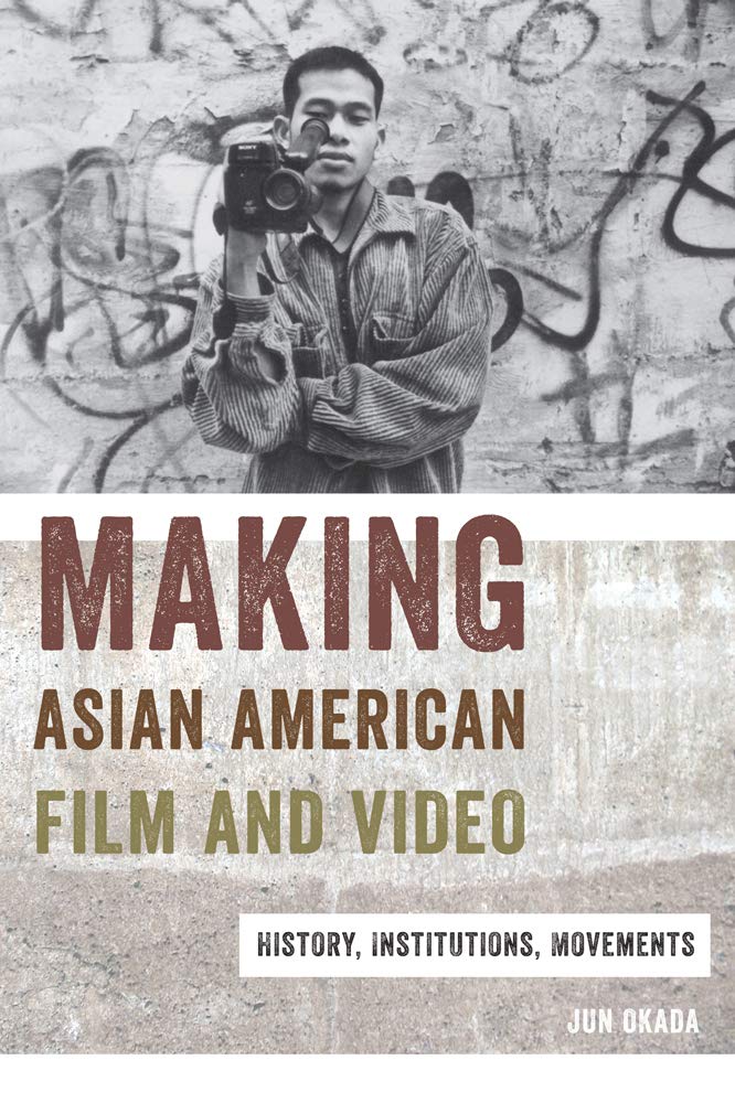 The cover of Making Asian American Film and Video. There is a black and white image of an Asian person with a film camera at the top.