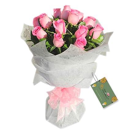 The FloralMart Fresh Flower Bouquet of 8 Pink Roses in Paper Packing