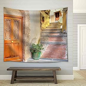 Wooden Door at The Entrance to Small House on Narrow Cobbled Street in Town of Ventimiglia in Liguria, Italy. - Fabric Wall Tapestry Home Decor - 51x60 inches