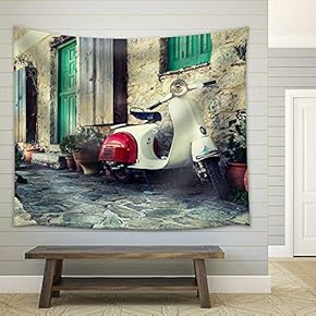 Old Scooter Parked by The Wall in The Empty Street of Karpathos, Greece. Post Processed with Vintage filte - Fabric Wall Tapestry Home Decor - 51x60 inches
