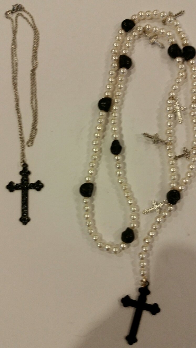 Catholic Rosary with white Kulture pearls black bead spacers and small silver crucifixes and a large black crucifix. Also comes with a separate necklace with a black cross. (White)