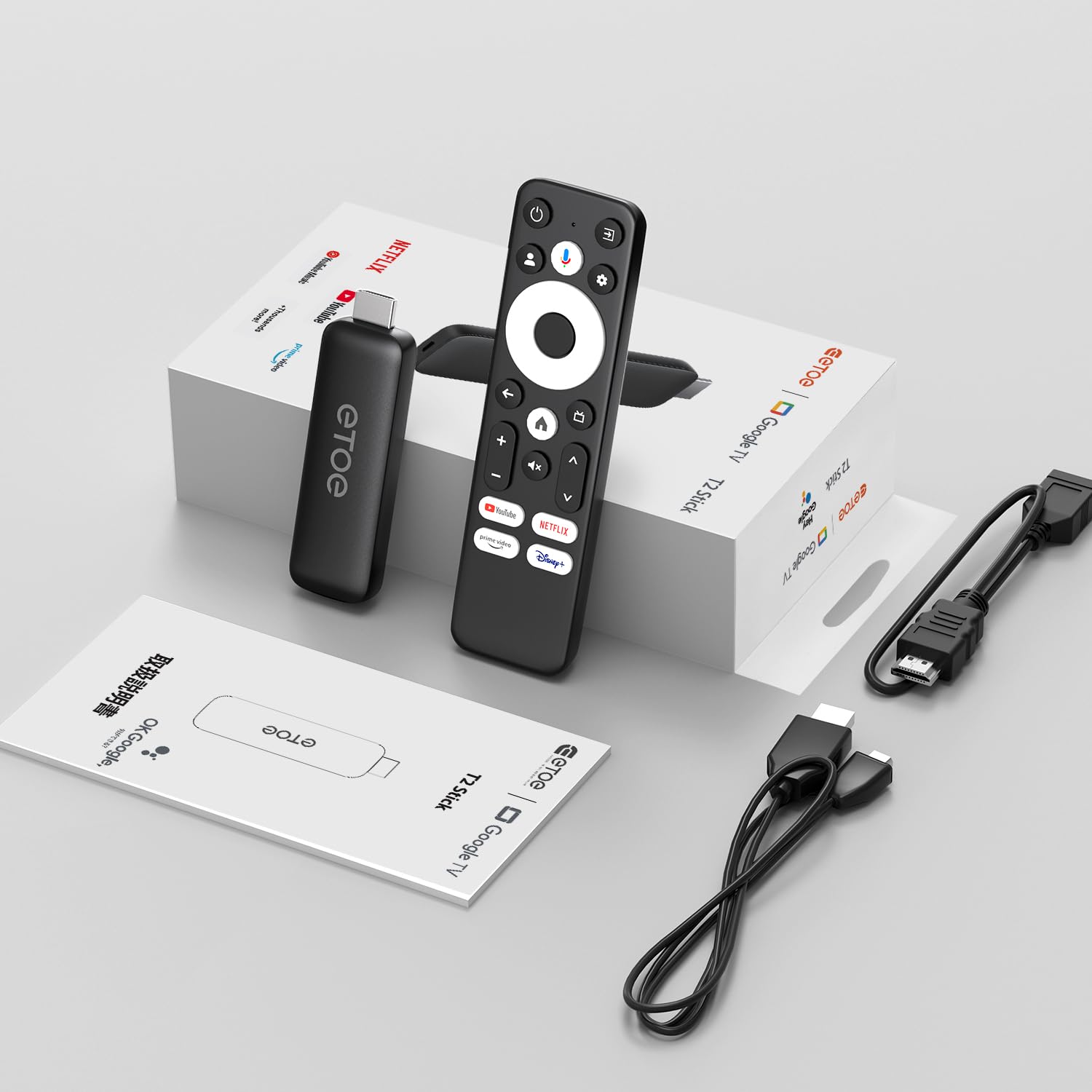 Contents of the ETOE Google TV Streaming Device box, including the streaming stick, remote, cables, and manual.