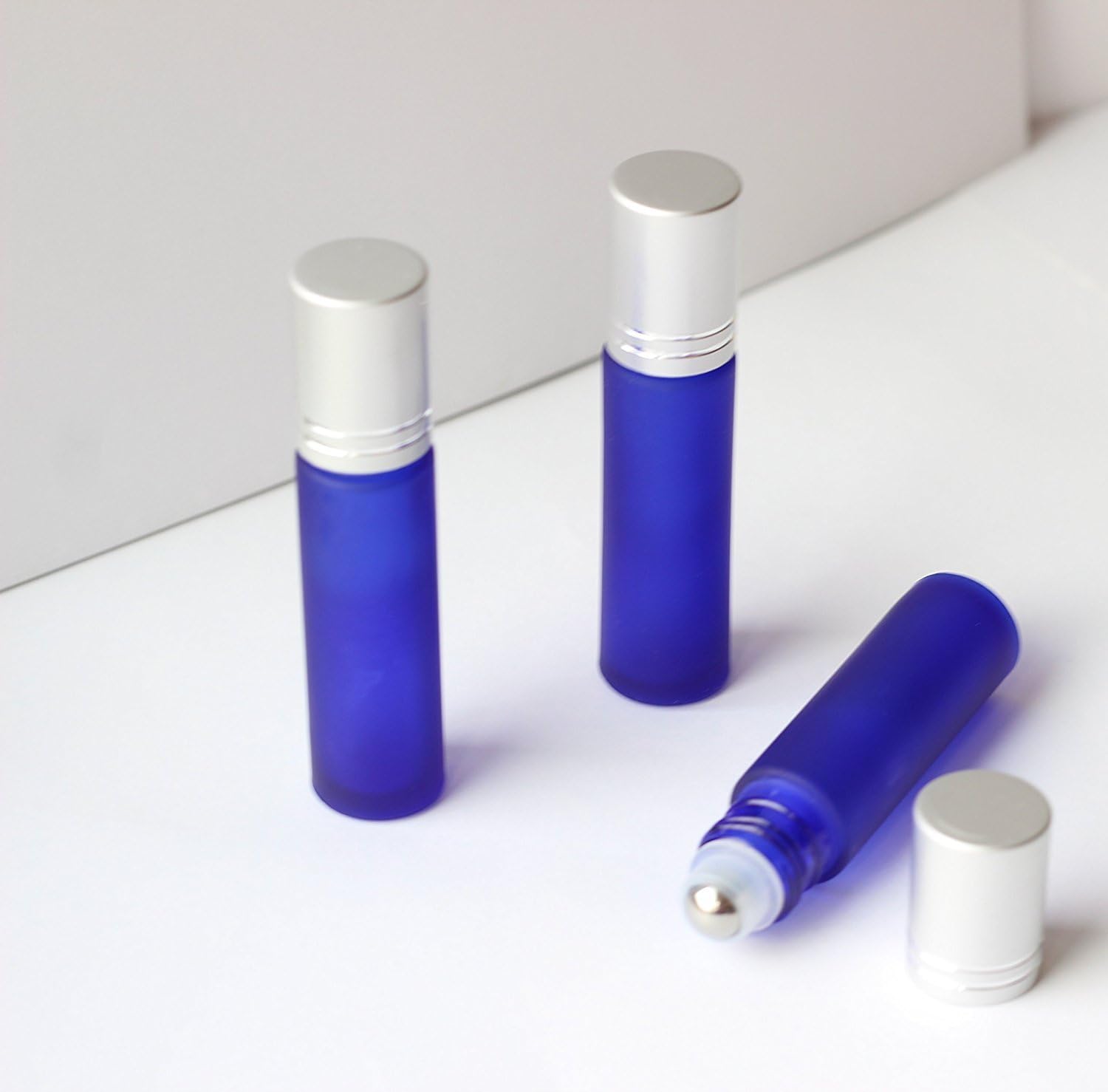 3 Pack Gift Box Empty Roll on Fancy Blue Glass Bottle 10ml Refillable Color Roller for Fragrance Essential Oils – Stainless Steel Roller Ball - 10 Ml 1/3 Oz - Silver Cap, Frosted Blue Perfume Bottle