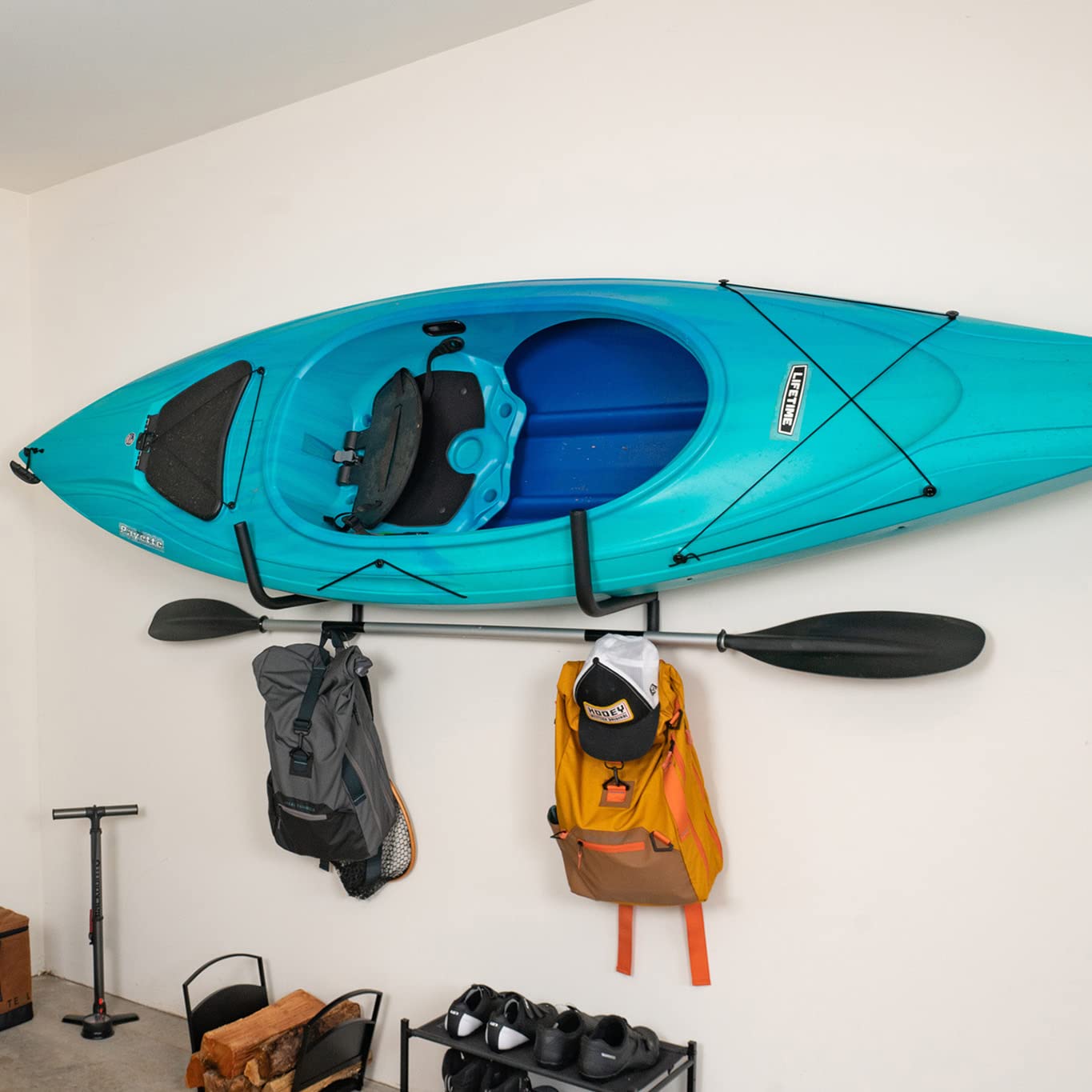 StoreYourBoard Kayak Wall Mount with Paddle Hanger, Indoor & Outdoor Folding Storage Rack, Heavy Duty Wall-Mounted Kayak Hanger with Protective Padding, Holds up to 100 lbs