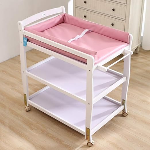 pink crib with changing table