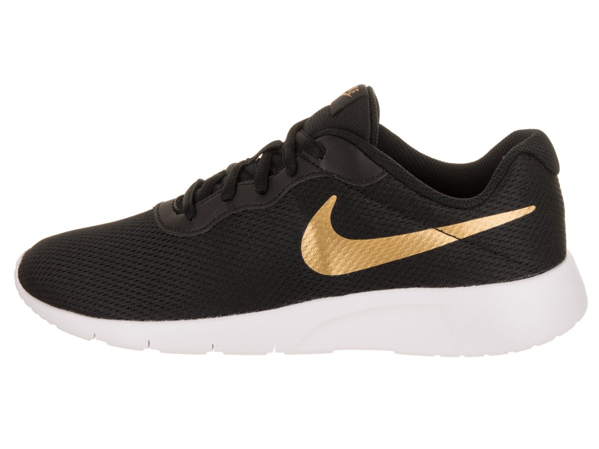 nike tanjun negro dorado