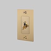 Buster and Punch 1 Gang Single Light Switch 1-Way Cross Knurl with Logo in Brass
