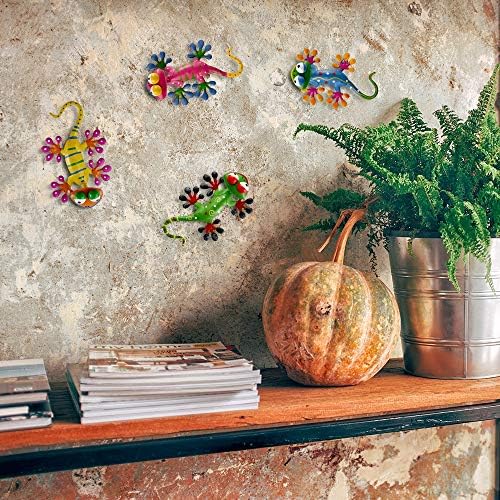 Colorful gecko metal wall art decor on a fence.