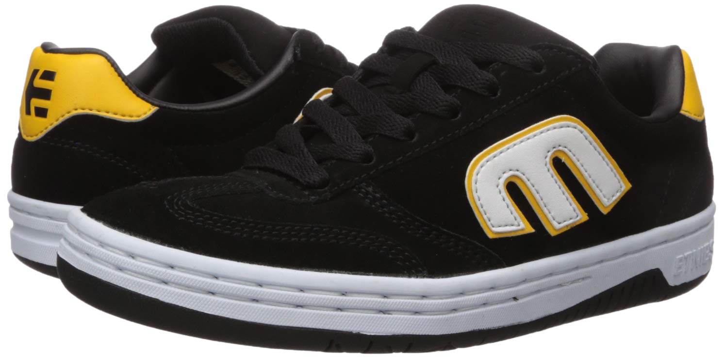 black and yellow etnies