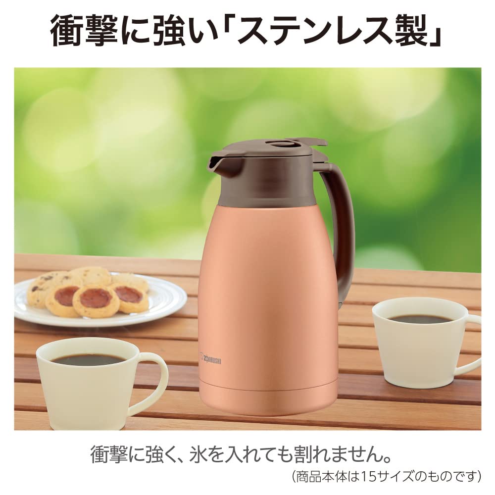 Hand pouring coffee from the Zojirushi vacuum bottle into a cup