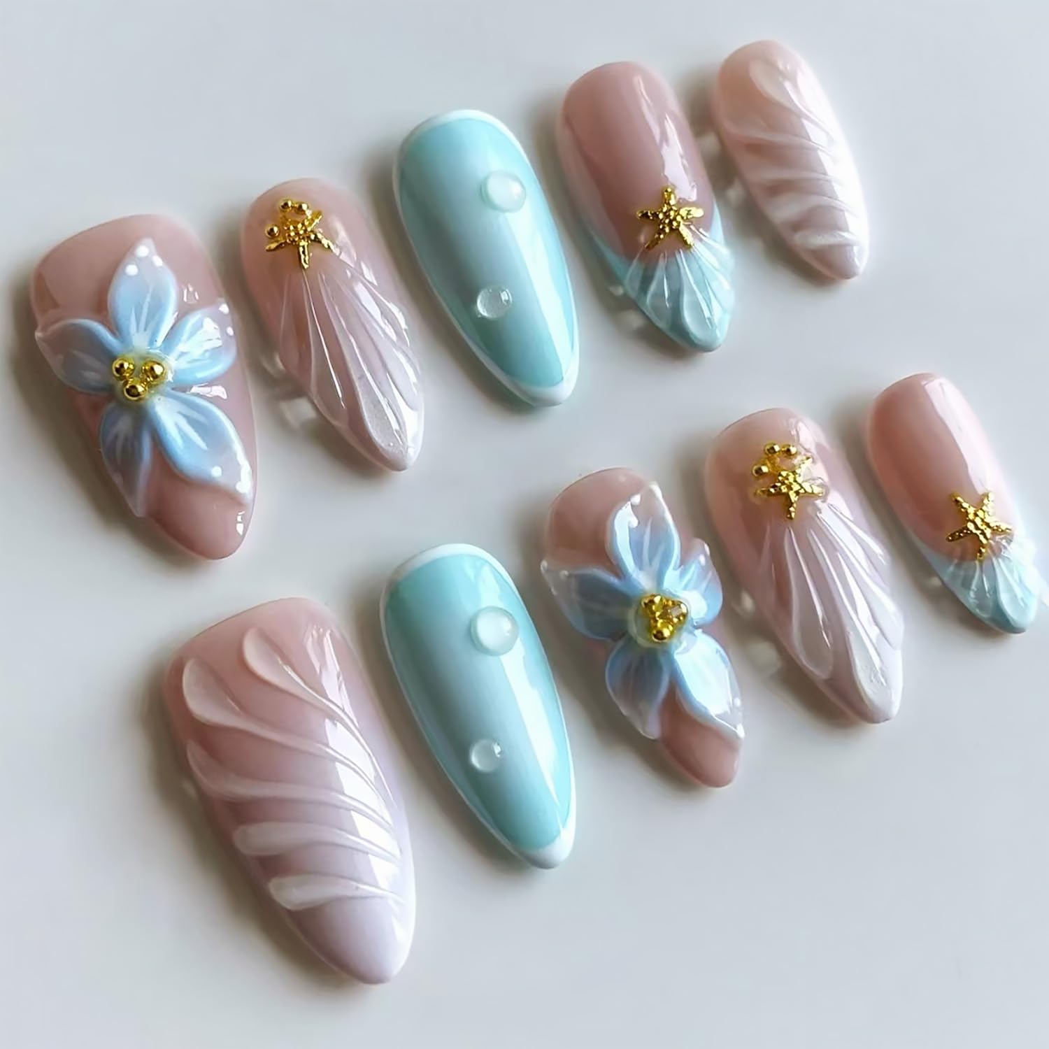Photo 1 of 24Pcs Blue Flower Press on Nails Medium Almond French Tip Fake Nails with Gold Starfish Rhinestones Design 3D Ripple False Nails Full Cover Artificial Glue on Nails Summer Stick on Nails for Women DIY
