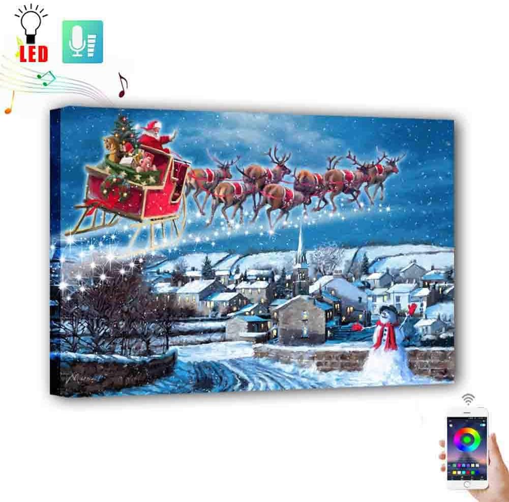 Led Canvas Painting Christmas Santa and Reindeer with Snowman in Winter Village, USB Power Buletooth Control with Timer Led Colors Change by Music Light up Wall Art Holiday Home Decor(12"x16"x1.26" )