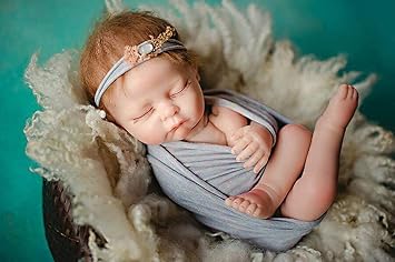 newborn posing doll