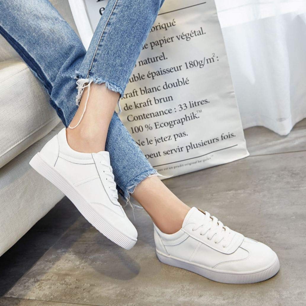 white flat trainers womens