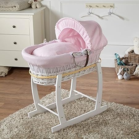 pink moses basket with rocking stand