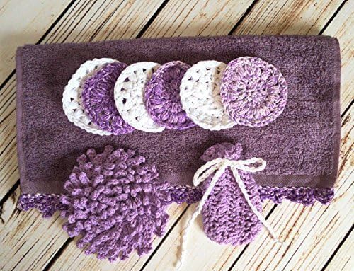 Invigorating yet gentle face and body poufs. Hand crocheted dusty purple colored spa/bath set. Set includes face towel with matching edging, nubby washcloth, soap saver, and reusable facial scrubbies.