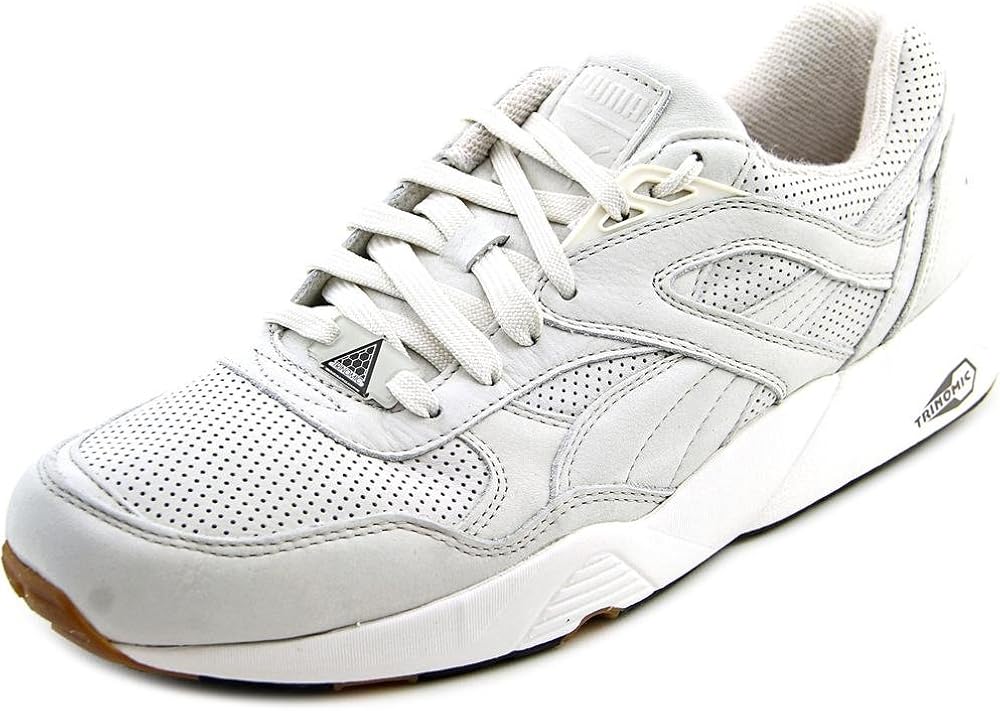 white and gold fila trainers