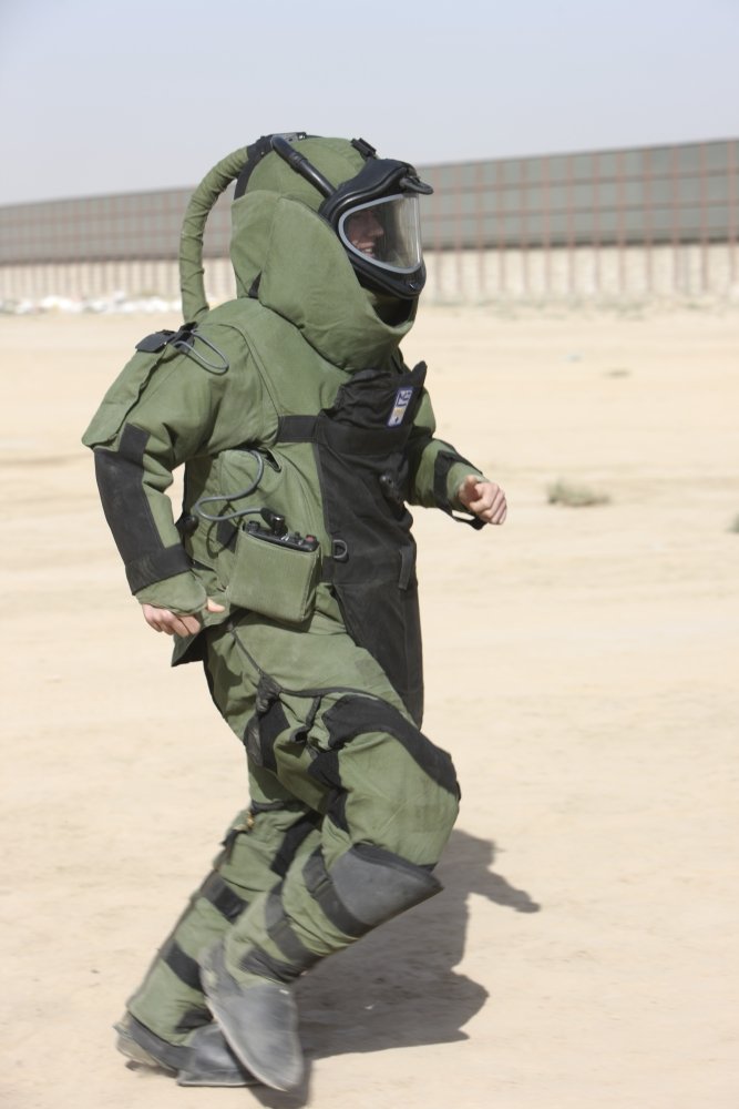 Posterazzi PSTTMO100381MLARGE Kunduz Afghanistan - A U.S. Marine tries running in a German Army EOD 