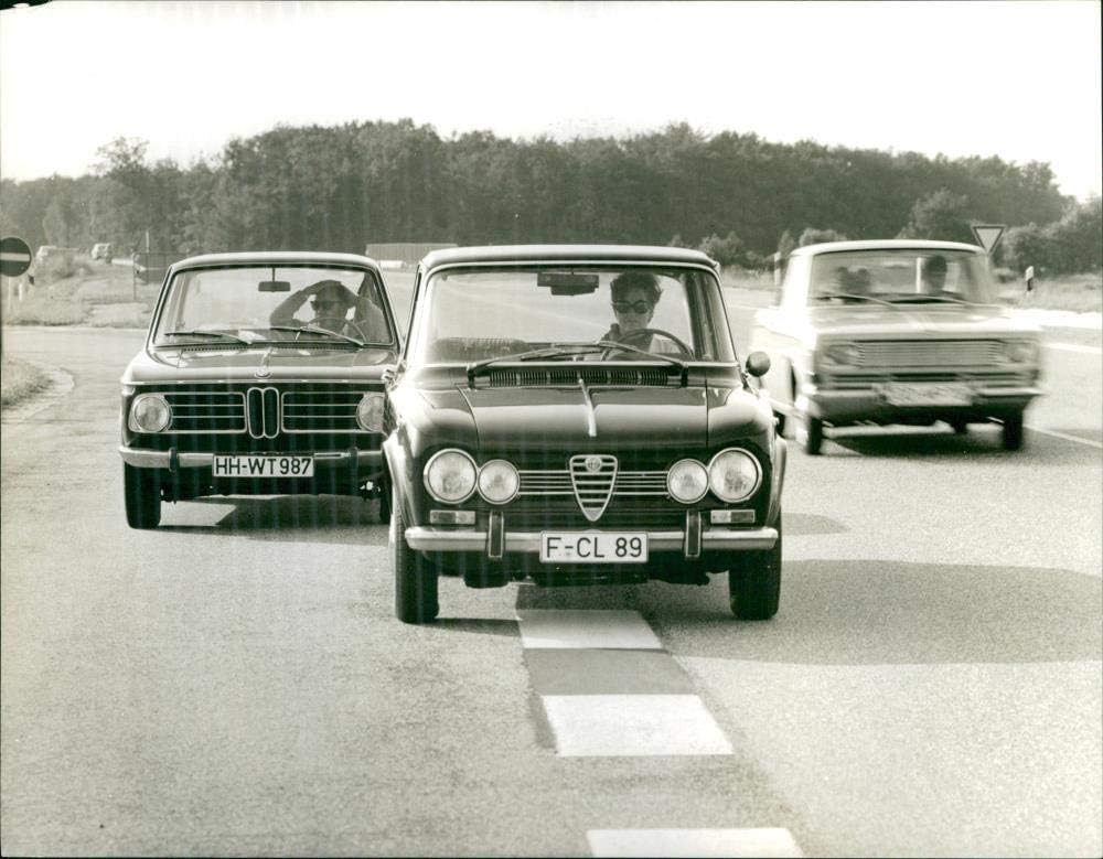 Vintage photo of 1969 Alfa Romeo Giulia 1300 TI and BMW